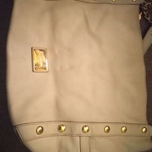 Two Micheal kors purses black and beige.